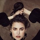 Sofia Carson به عنوان Nora Parisi