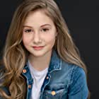 Ava Grace Cooper به عنوان Young Krista