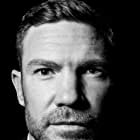 Nate Boyer به عنوان Detective Drew Carter